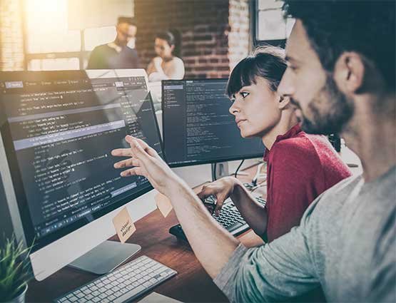Developers collaborating around website application code